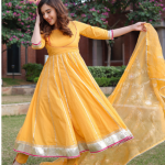 Indian women wearing designer yellow suit set
